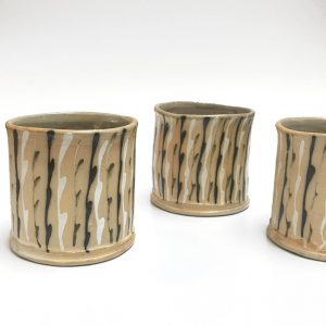 ceramic cups with black and white lines by Hayne Bayless