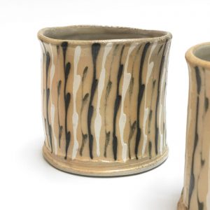 ceramic cups with black and white lines by Hayne Bayless